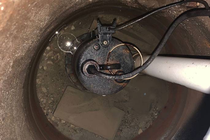 Residential sewage ejector pump unit with control panel visible