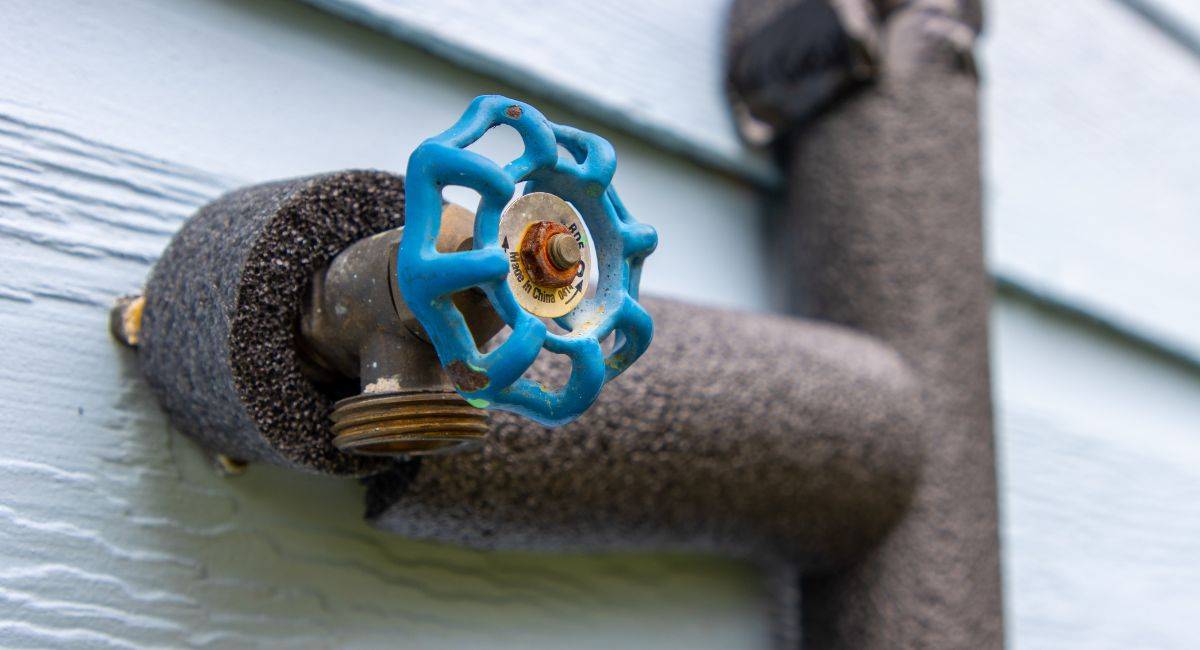 how to prevent pipes from freezing. Water pipes wrapped with insulation to prevent freezing.