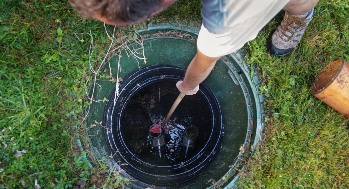 Text: Plumbers in Clanton performing septic tank maintenance for residential and commercial properties.