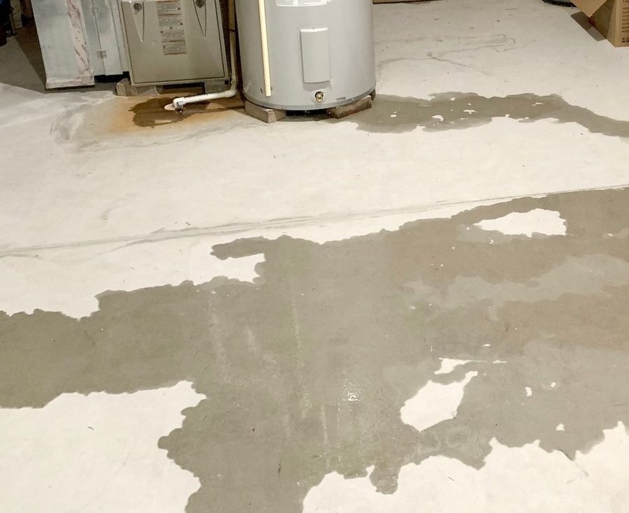garage floor showing a water leak
